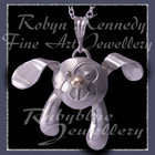 14 Karat Gold and Sterling Silver 'Binky' Dog Pendant Image