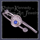 Sterling Silver and Genuine Glacier Blue Topaz 'Fleur' Bangle Bracelet Image