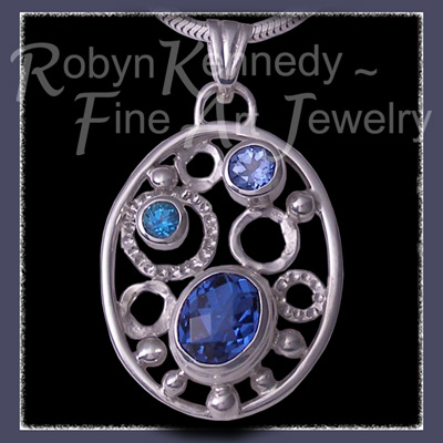 Sterling Silver, Glacier, Paraiba Blue and  Paradise Blue Topaz 'Moody Blues' Pendant Image