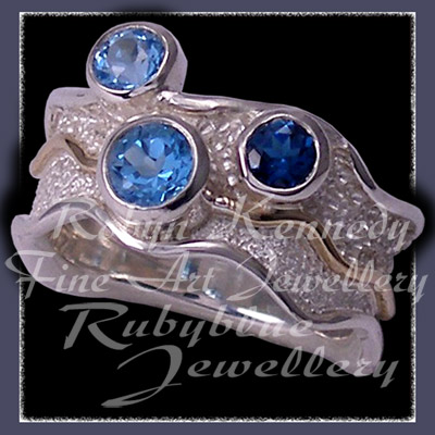 Sterling Silver, 14 Karat Yellow Gold, Swiss, London and Sky Blue Topaz 'Blue Pleasures' Ring Image